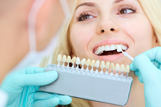 Closeup of a girl with beautiful smile at the dentist. Dental